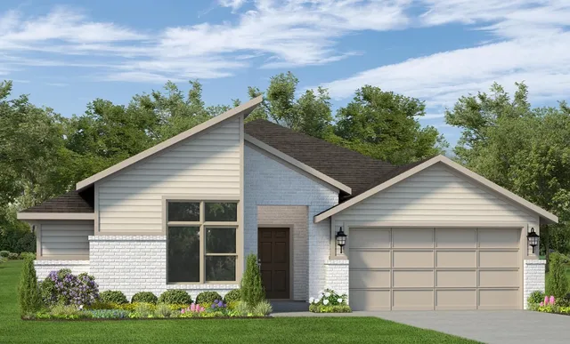 a view of a house with yard and green space