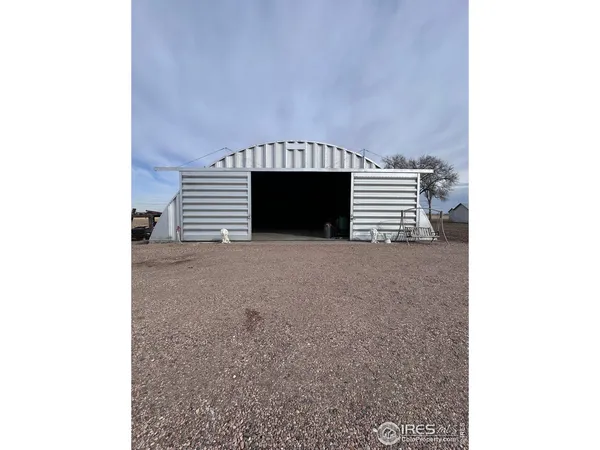 a view of a house with a yard and garage