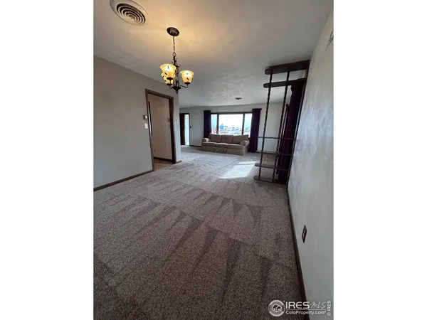 a view of a hallway with a chandelier