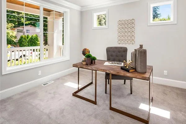 a workspace with furniture and a window