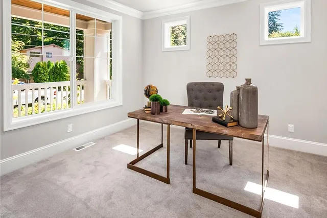 a workspace with furniture and a window