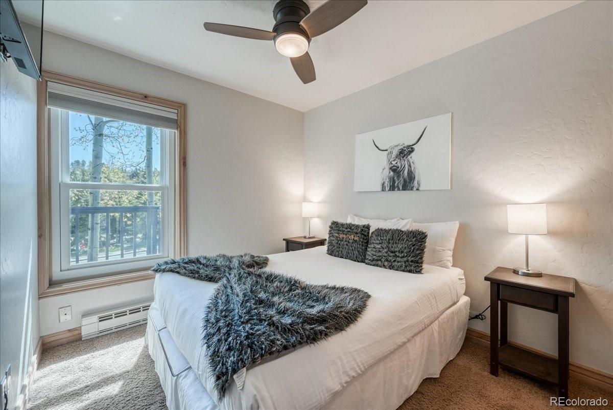 200 North Ridge Street, Unit R1 Breckenridge, CO 80424 - Photo 2 of 27 a bedroom with a bed and a window