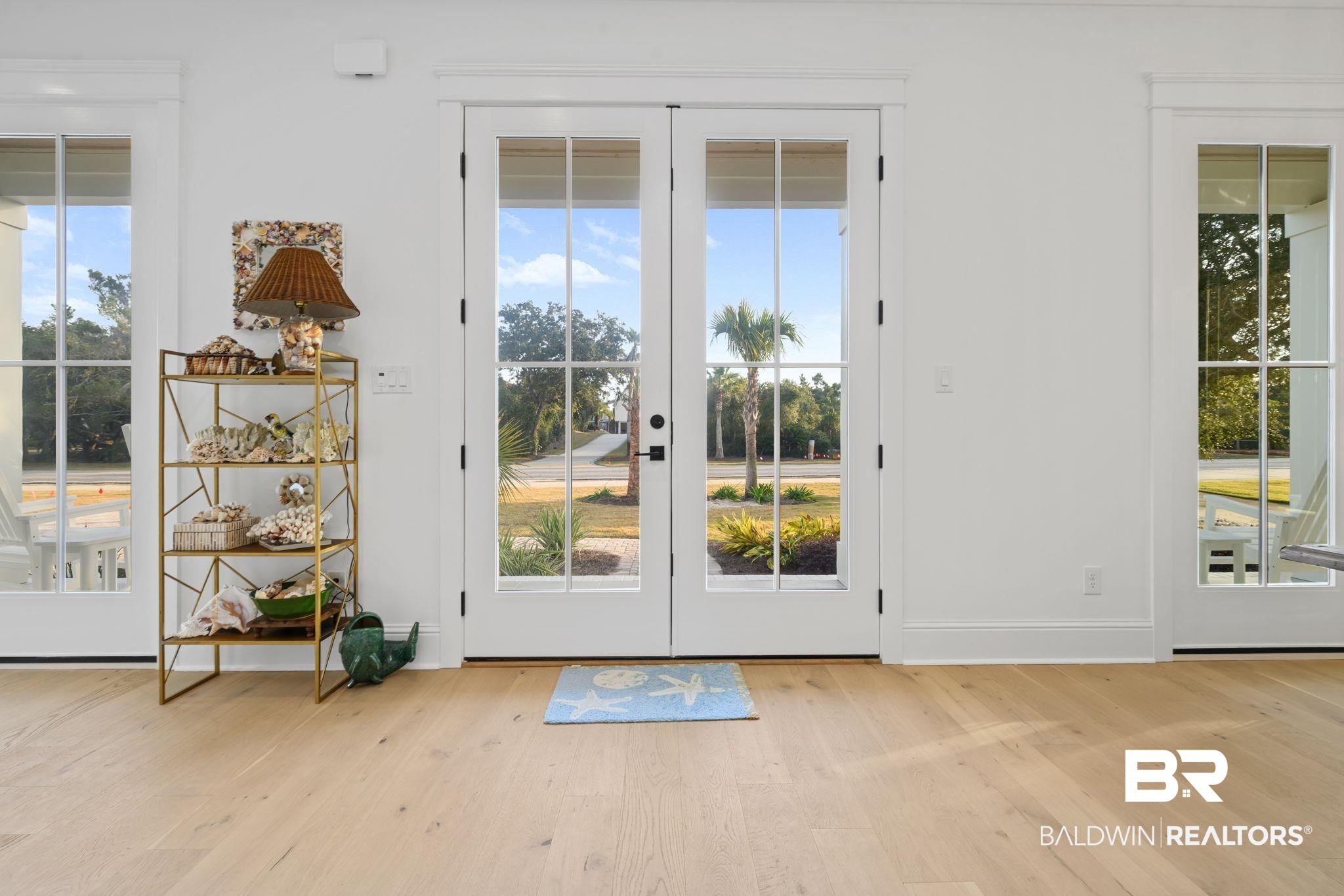 30313 River Road Orange Beach, AL 36561 - Photo 12 of 50 Entryway featuring french doors and wood finished floors