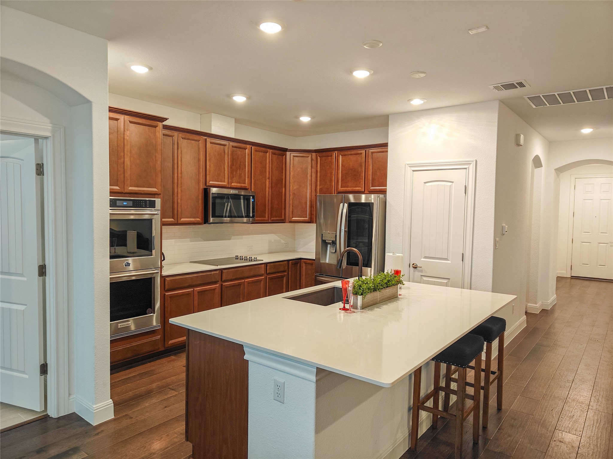 200 Fiddleneck Road Marble Falls, TX 78654 - Photo 8 of 37 a kitchen with kitchen island a stove a sink a refrigerator and cabinets