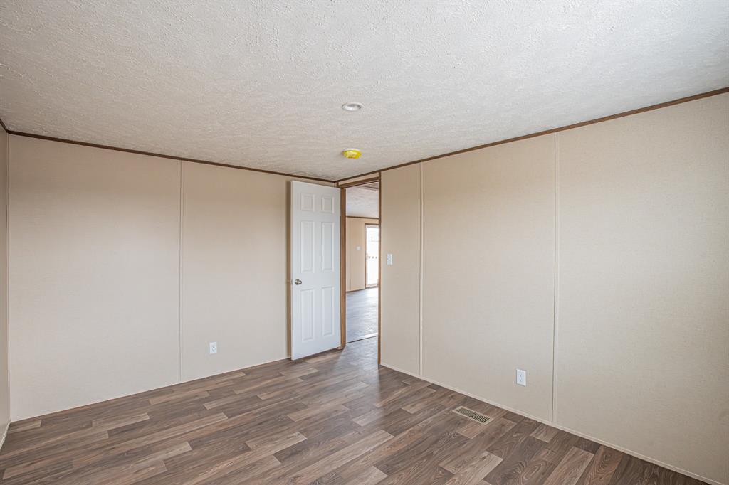 150 Leech Road Poolville, TX 76487 - Photo 28 of 34 a view of an empty room