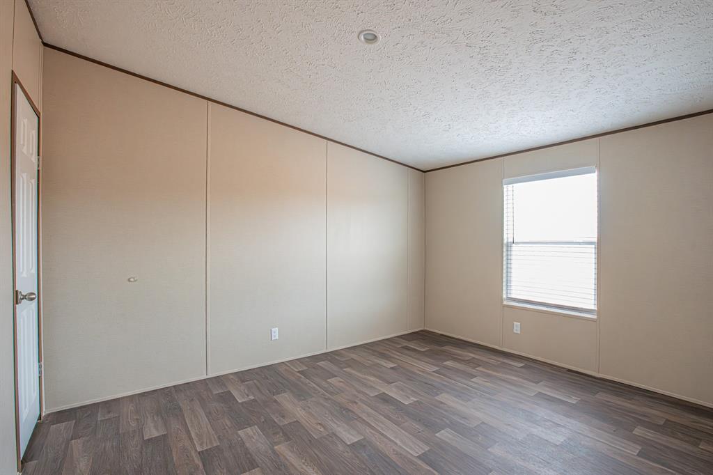 150 Leech Road Poolville, TX 76487 - Photo 30 of 34 an empty room with a window