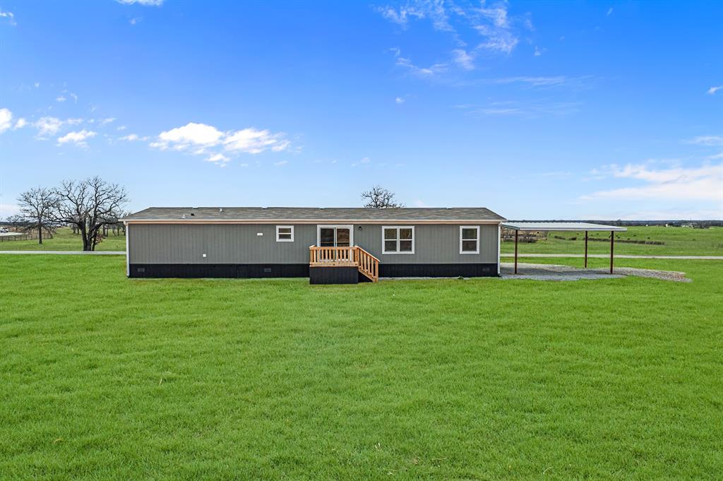 150 Leech Road Poolville, TX 76487 - Photo 34 of 34 a view of a house with a big yard