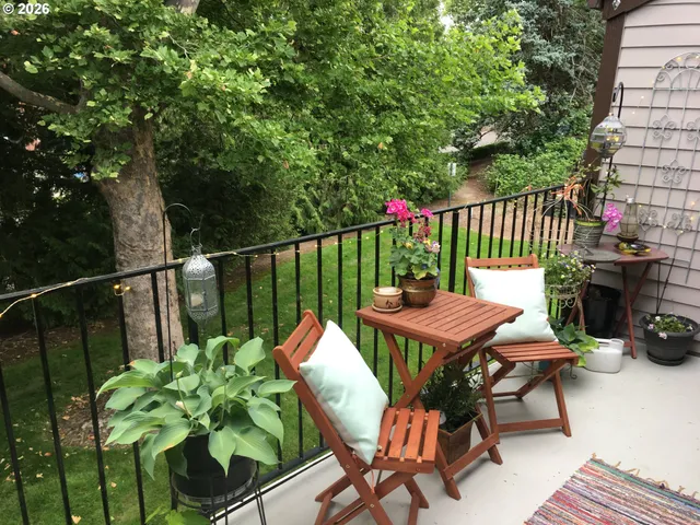 a view of a chairs and table in patio