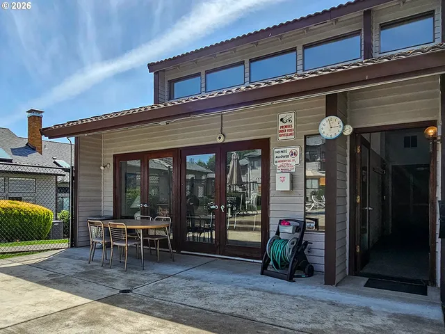 a view of a cafe with sitting area