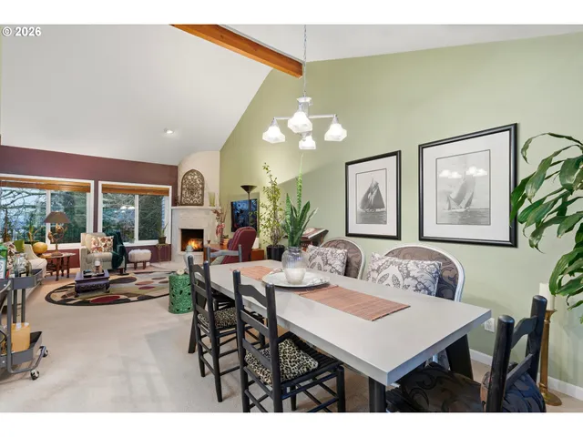a view of a dining room with furniture and a potted plant