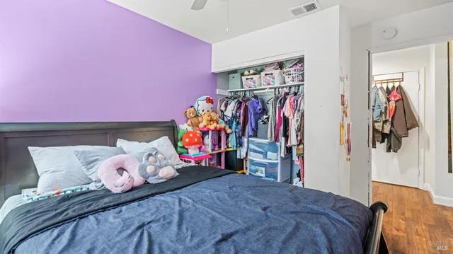 a bedroom with a bed and a walk in closet
