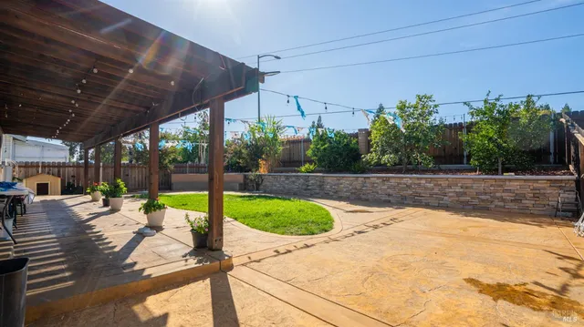 a view of a backyard with sitting area