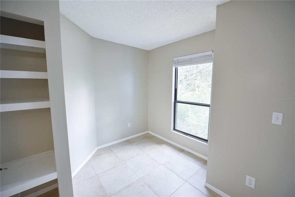 455 Alt 19, Unit 92 Palm Harbor, FL 34683 - Photo 12 of 19 an empty room with windows and closet