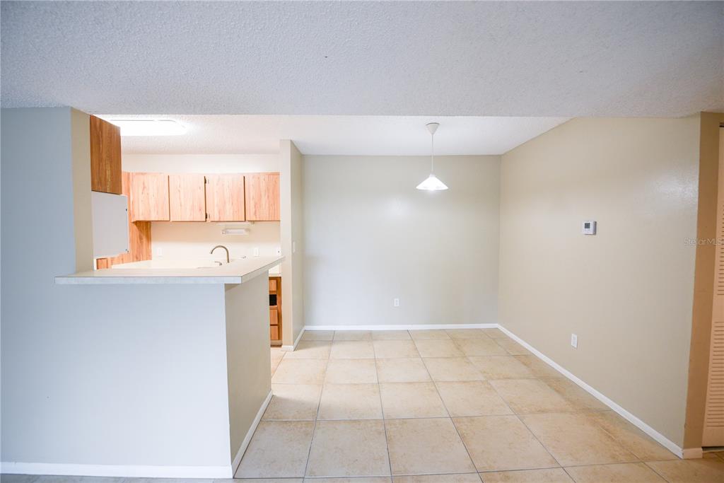 455 Alt 19, Unit 92 Palm Harbor, FL 34683 - Photo 13 of 19 a view of a kitchen with a sink and a window