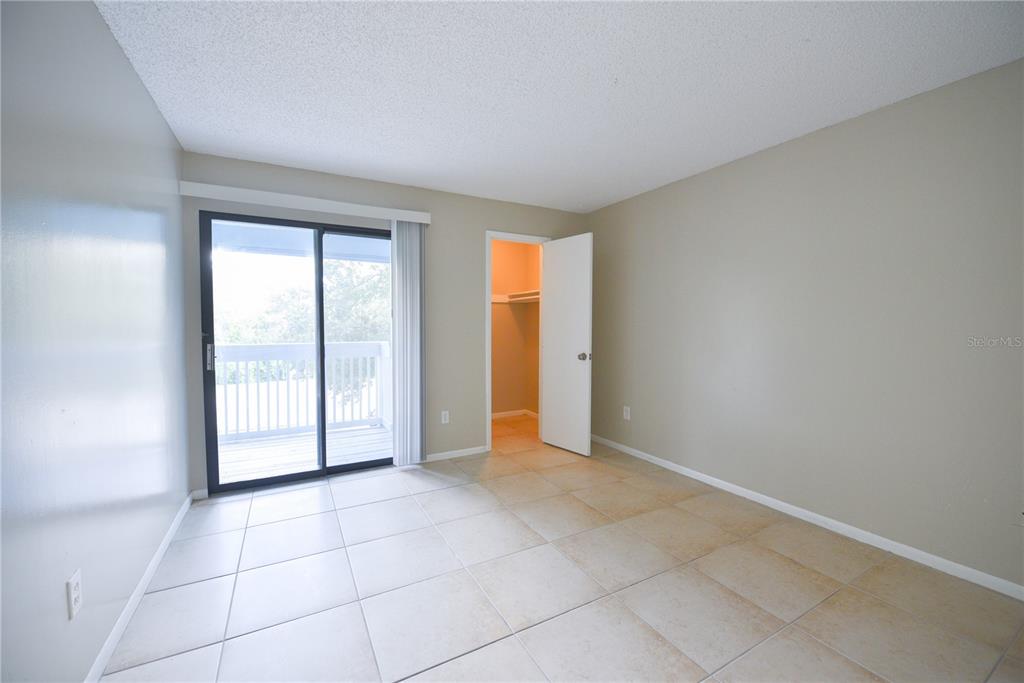 455 Alt 19, Unit 92 Palm Harbor, FL 34683 - Photo 17 of 19 an empty room with windows and closet