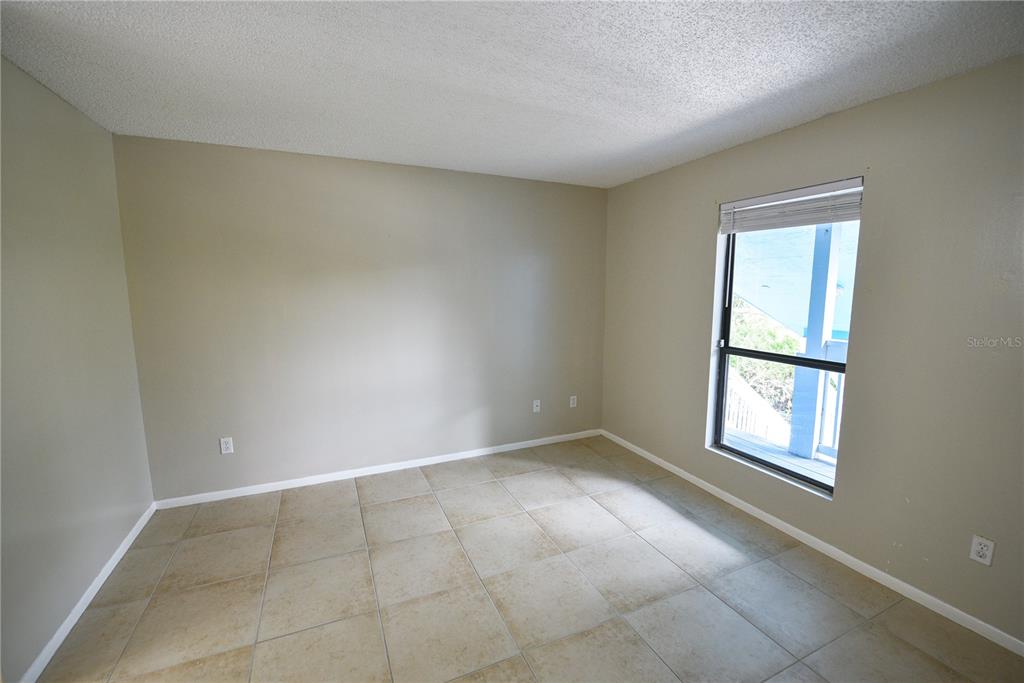 455 Alt 19, Unit 92 Palm Harbor, FL 34683 - Photo 7 of 19 an empty room with windows