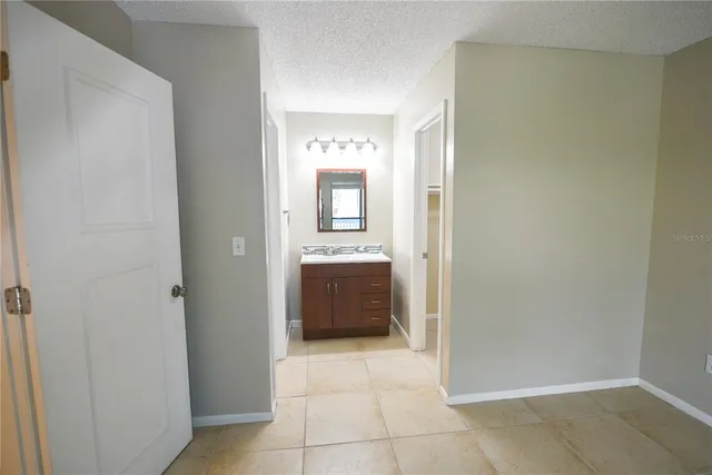 a white toilet sitting next to a bath tub