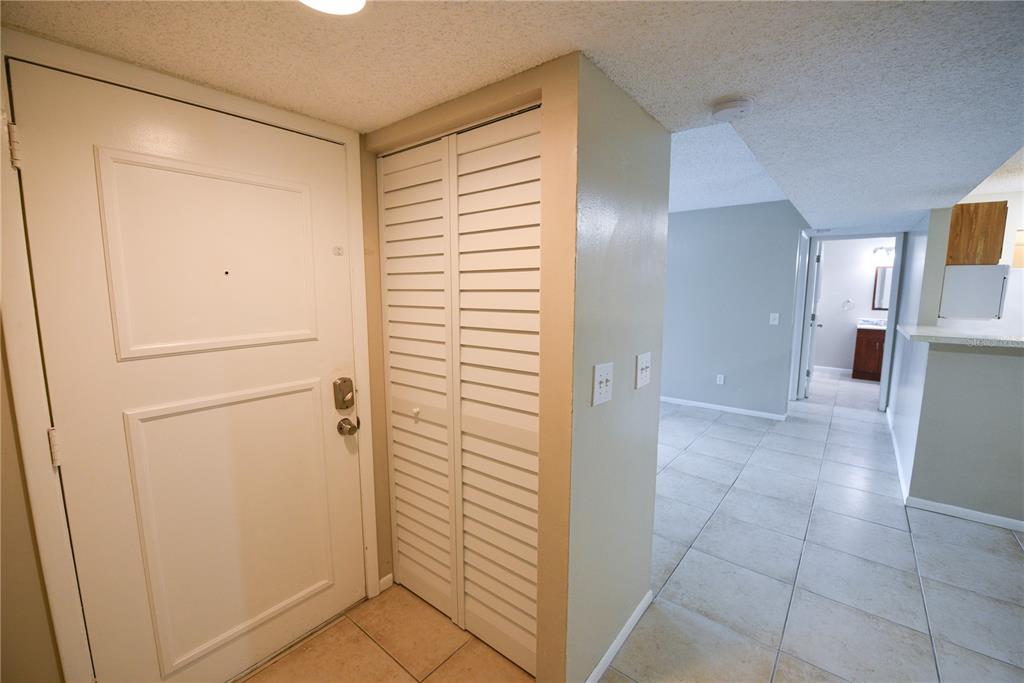 455 Alt 19, Unit 92 Palm Harbor, FL 34683 - Photo 10 of 19 a view of a hallway with closet and a window