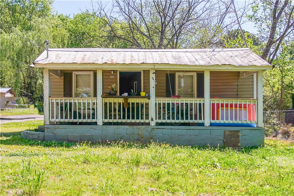 1422 Cassville Road Northwest Cartersville, GA 30121 - Photo 1 of 1 front view of a house with a yard