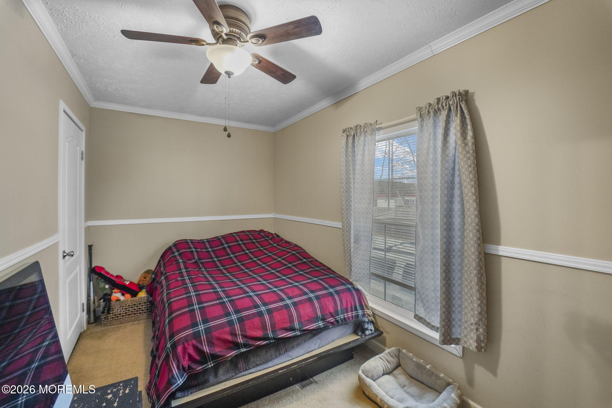 10 Citrus Lane Howell, NJ 07731 - Photo 14 of 20 a bedroom with a bed and a chandelier