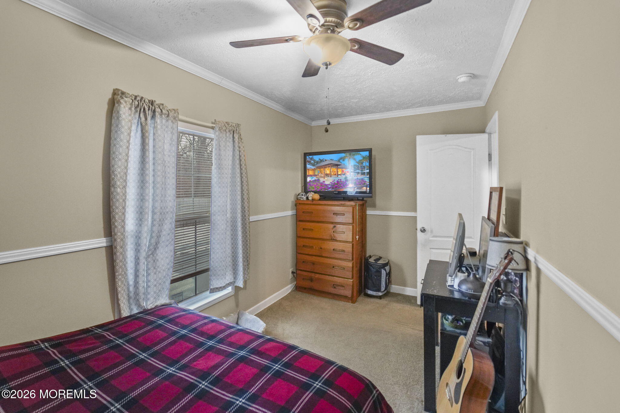 10 Citrus Lane Howell, NJ 07731 - Photo 15 of 20 a bedroom with a bed and a chandelier