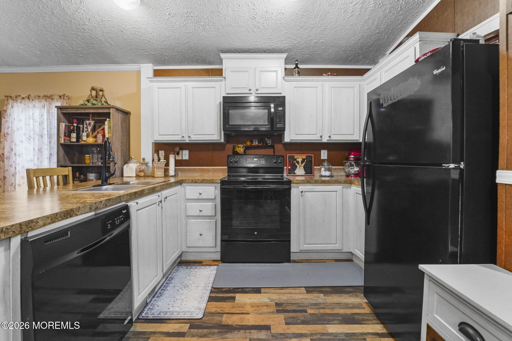 10 Citrus Lane Howell, NJ 07731 - Photo 5 of 20 a kitchen with a sink stove and refrigerator