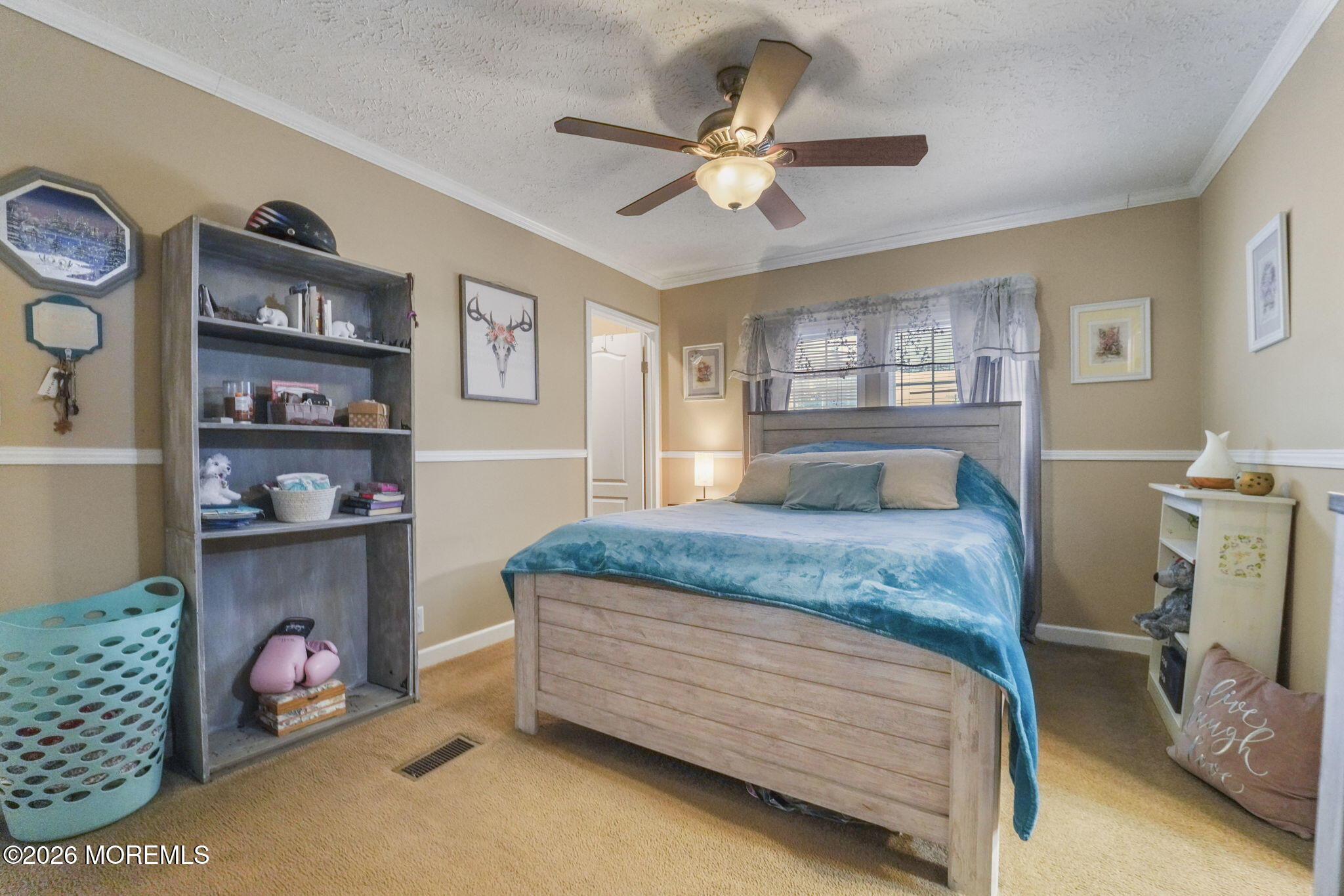 10 Citrus Lane Howell, NJ 07731 - Photo 9 of 20 a bedroom with a bed a study table and large window