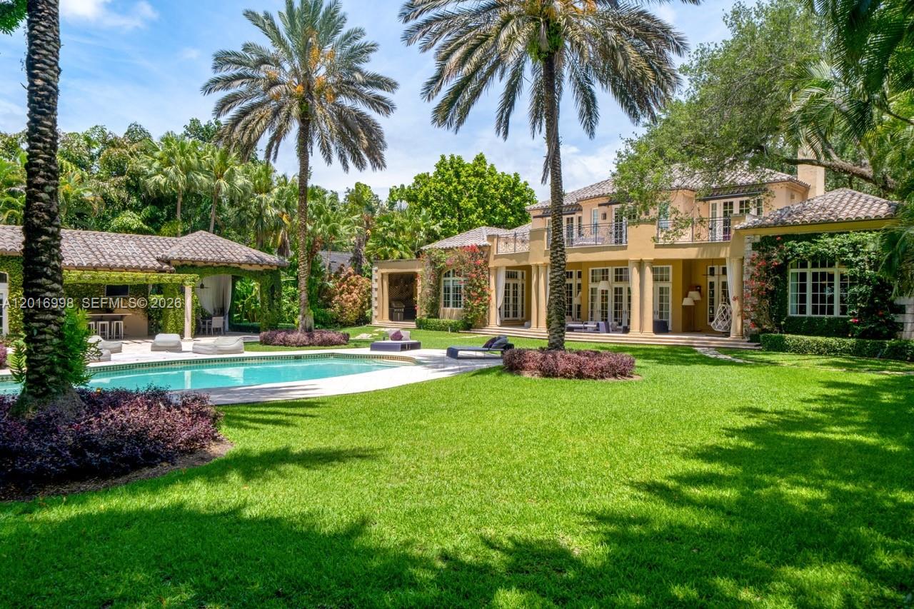 4790 Southwest 78th Street Miami, FL 33143 - Photo 2 of 33 a front view of a house with swimming pool having outdoor seating