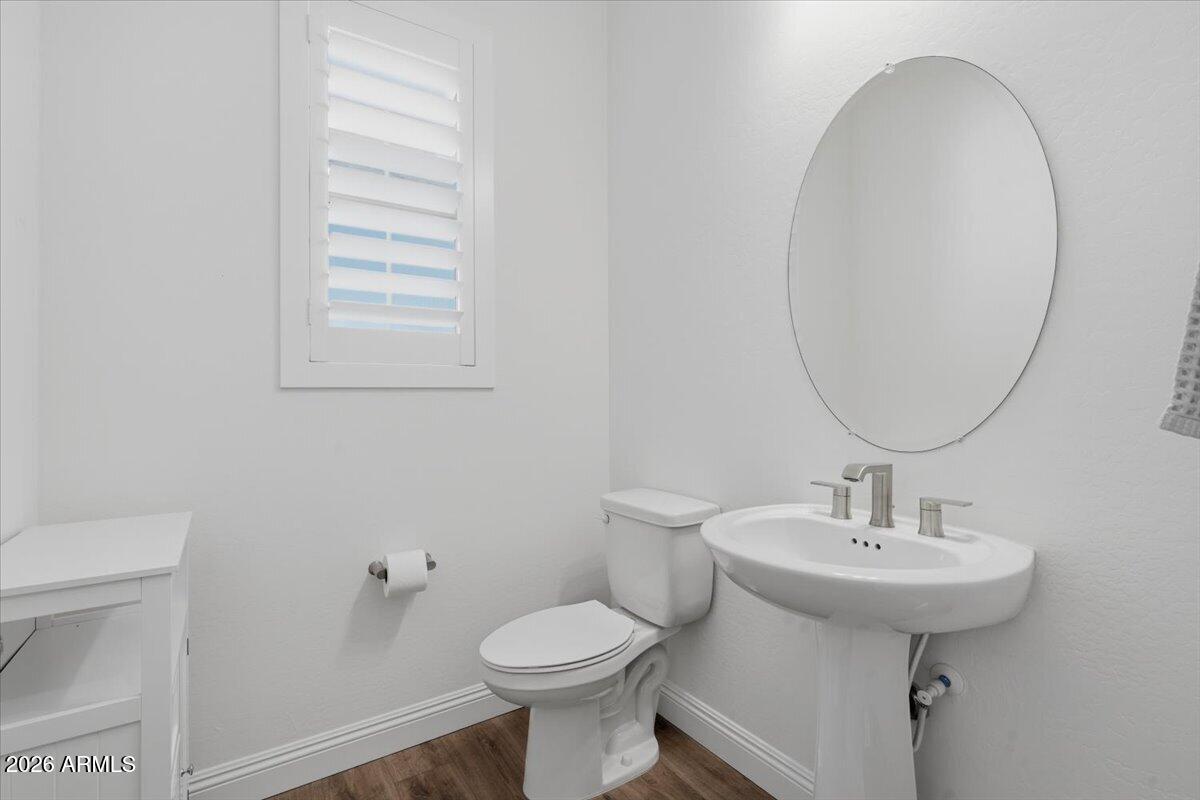 22608 East Stacey Road Queen Creek, AZ 85142 - Photo 13 of 83 a bathroom with a sink a toilet and a mirror