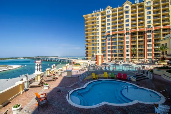 a view of a swimming pool with outdoor seating