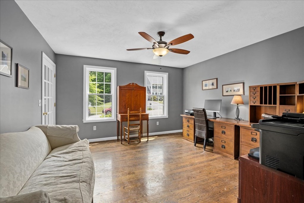 2 Harding Lane Sturbridge, MA 01518 - Photo 15 of 42 a living room with furniture a window and a flat screen tv