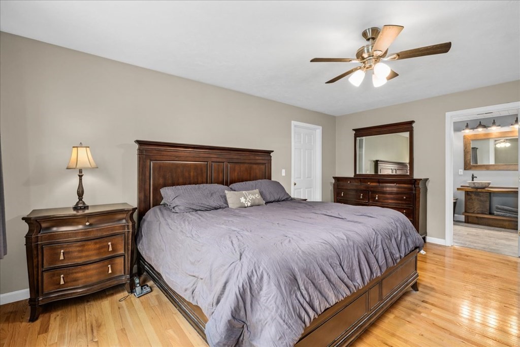2 Harding Lane Sturbridge, MA 01518 - Photo 19 of 42 a bedroom with a bed and dresser with wooden floor