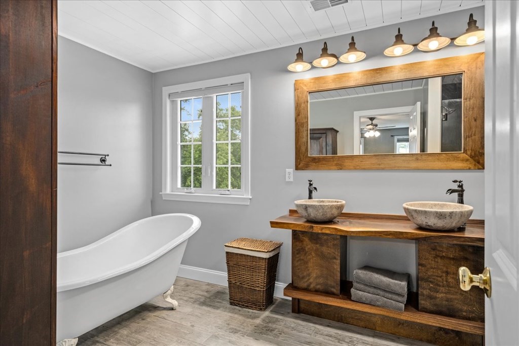2 Harding Lane Sturbridge, MA 01518 - Photo 20 of 42 a bathroom with a sink and a mirror