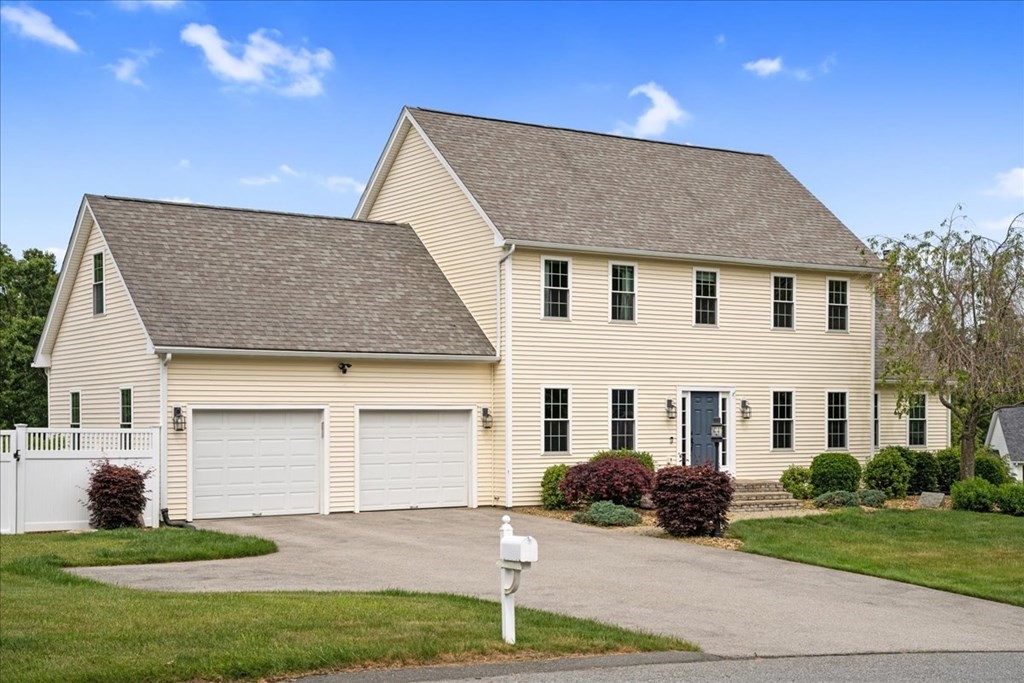 2 Harding Lane Sturbridge, MA 01518 - Photo 3 of 42 a house that has a big yard in front of it