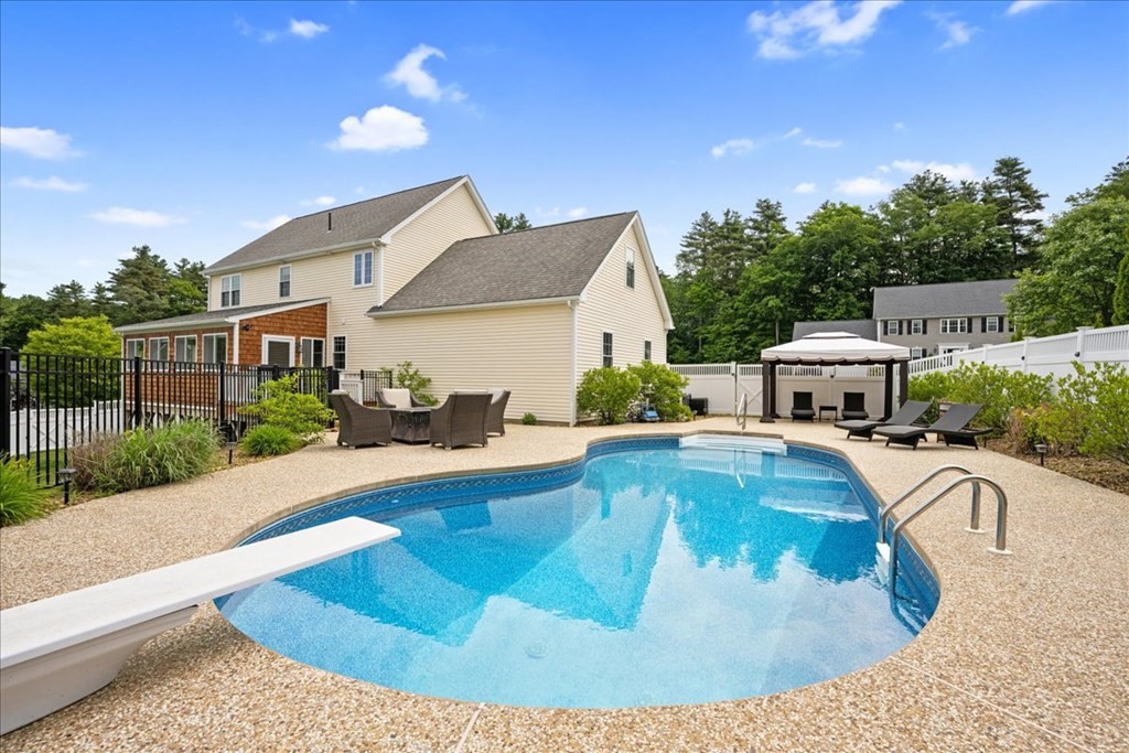 2 Harding Lane Sturbridge, MA 01518 - Photo 36 of 42 a view of a house with swimming pool and sitting area