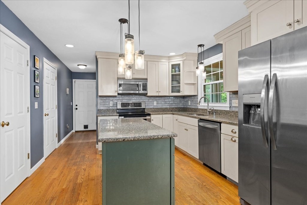 2 Harding Lane Sturbridge, MA 01518 - Photo 5 of 42 a kitchen with stainless steel appliances granite countertop a refrigerator a stove and a sink
