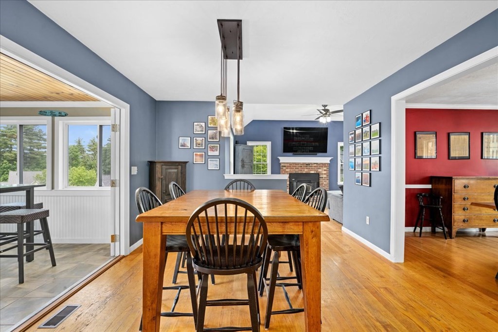 2 Harding Lane Sturbridge, MA 01518 - Photo 8 of 42 a dining room with furniture a chandelier and wooden floor
