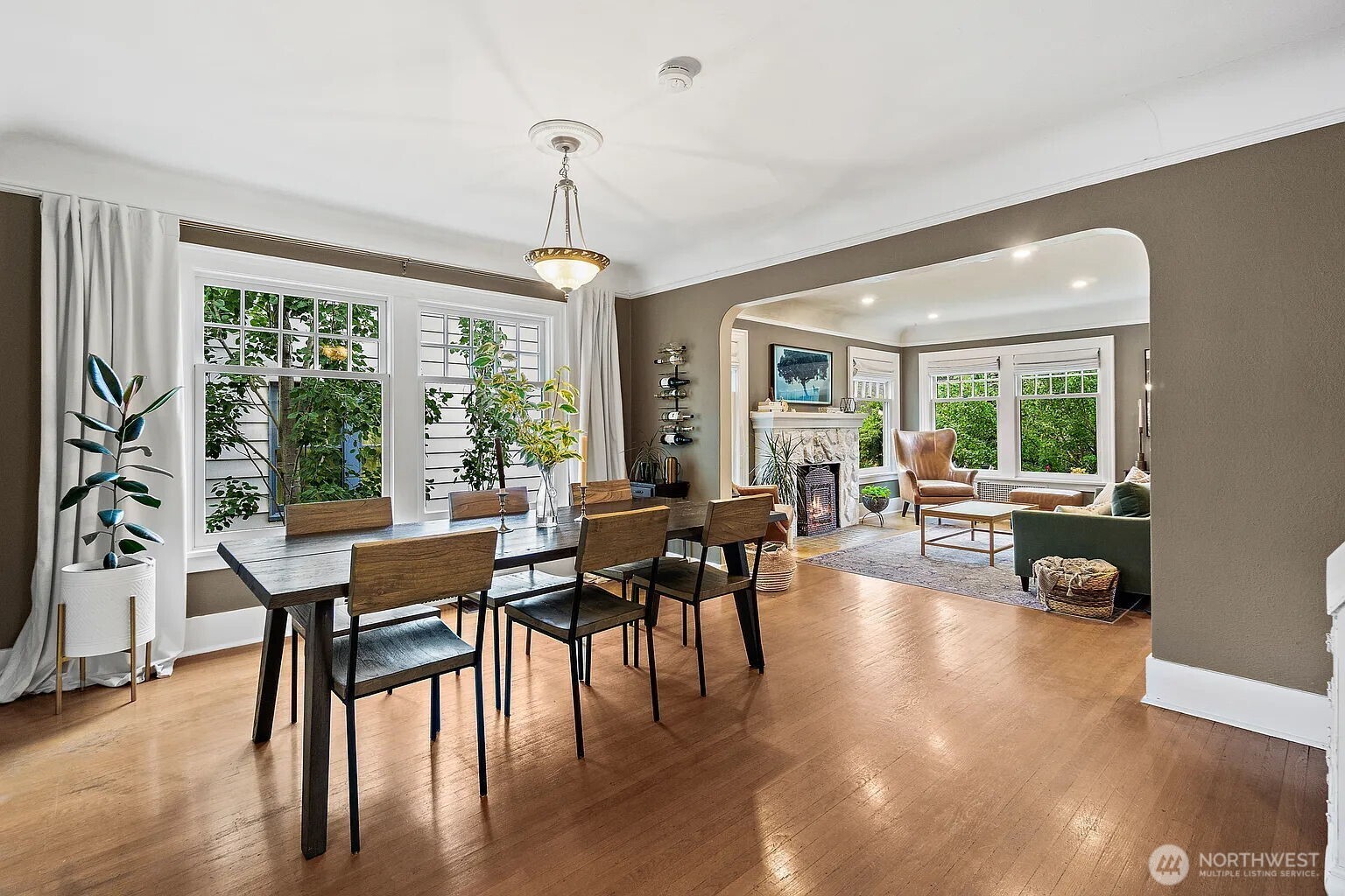 1114 North 77th Street Seattle, WA 98103 - Photo 12 of 30 a living room with furniture a table and a large window