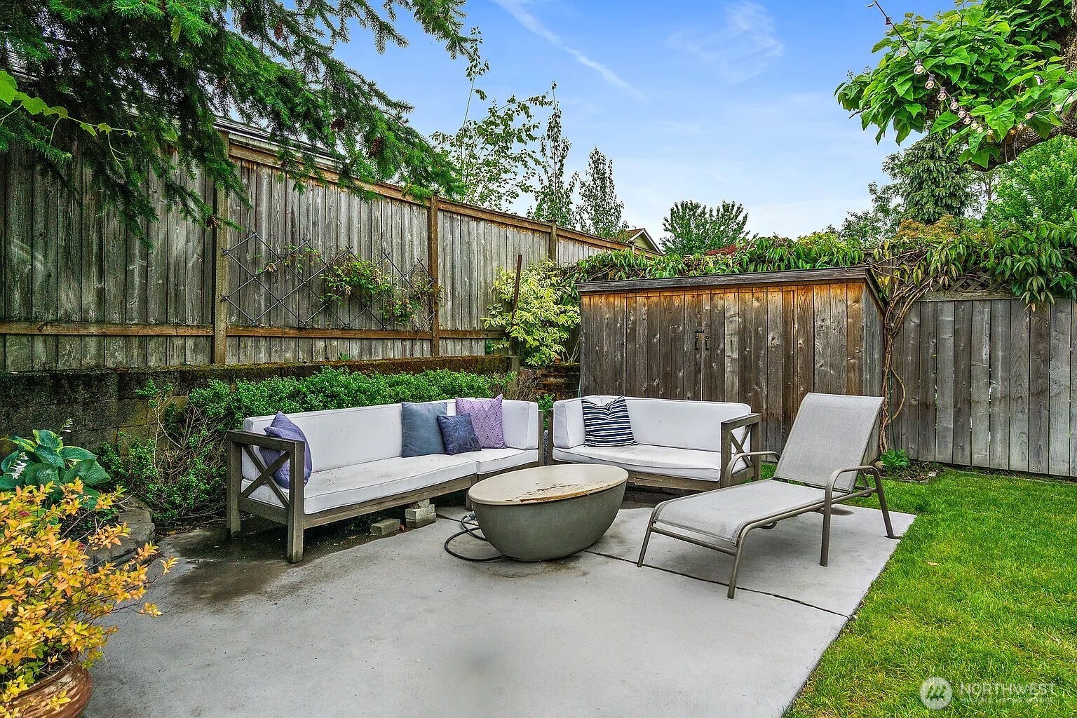 1114 North 77th Street Seattle, WA 98103 - Photo 16 of 30 a view of a patio with couches and a backyard
