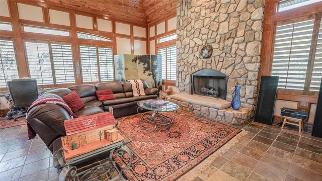 a large dining hall with stainless steel appliances granite countertop a stove and a sink