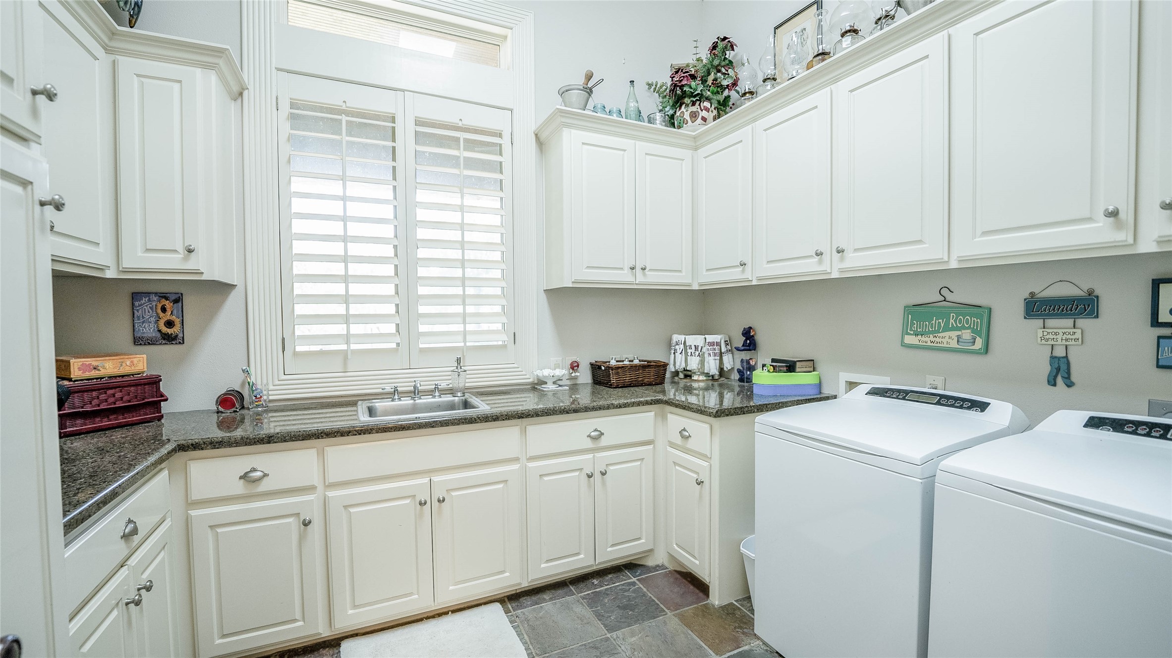 2042 22 Hills Road Gause, TX 77857 - Photo 28 of 50 a kitchen with cabinets appliances a sink and a window