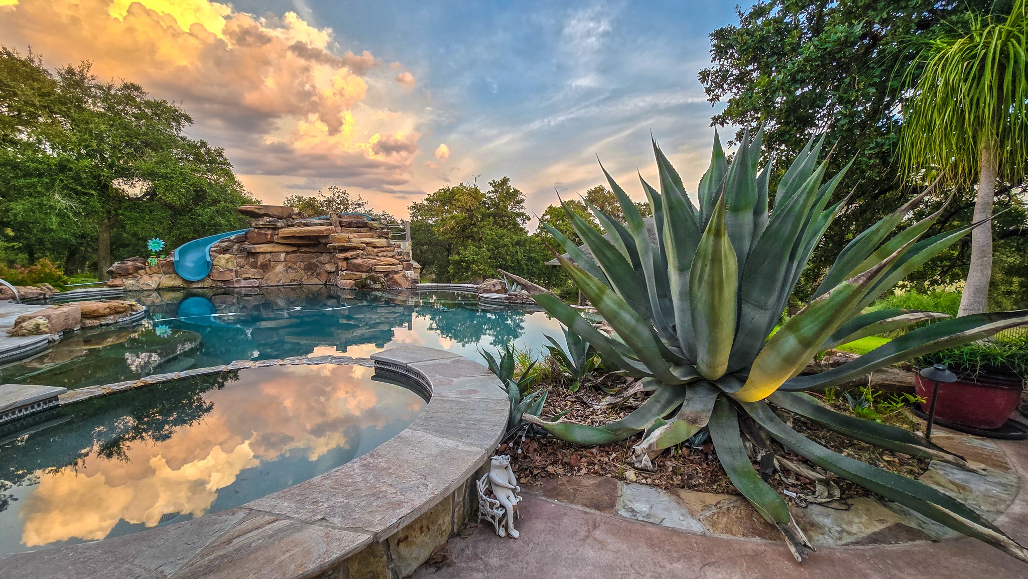 2042 22 Hills Road Gause, TX 77857 - Photo 32 of 50 a view of a backyard with plants and lake