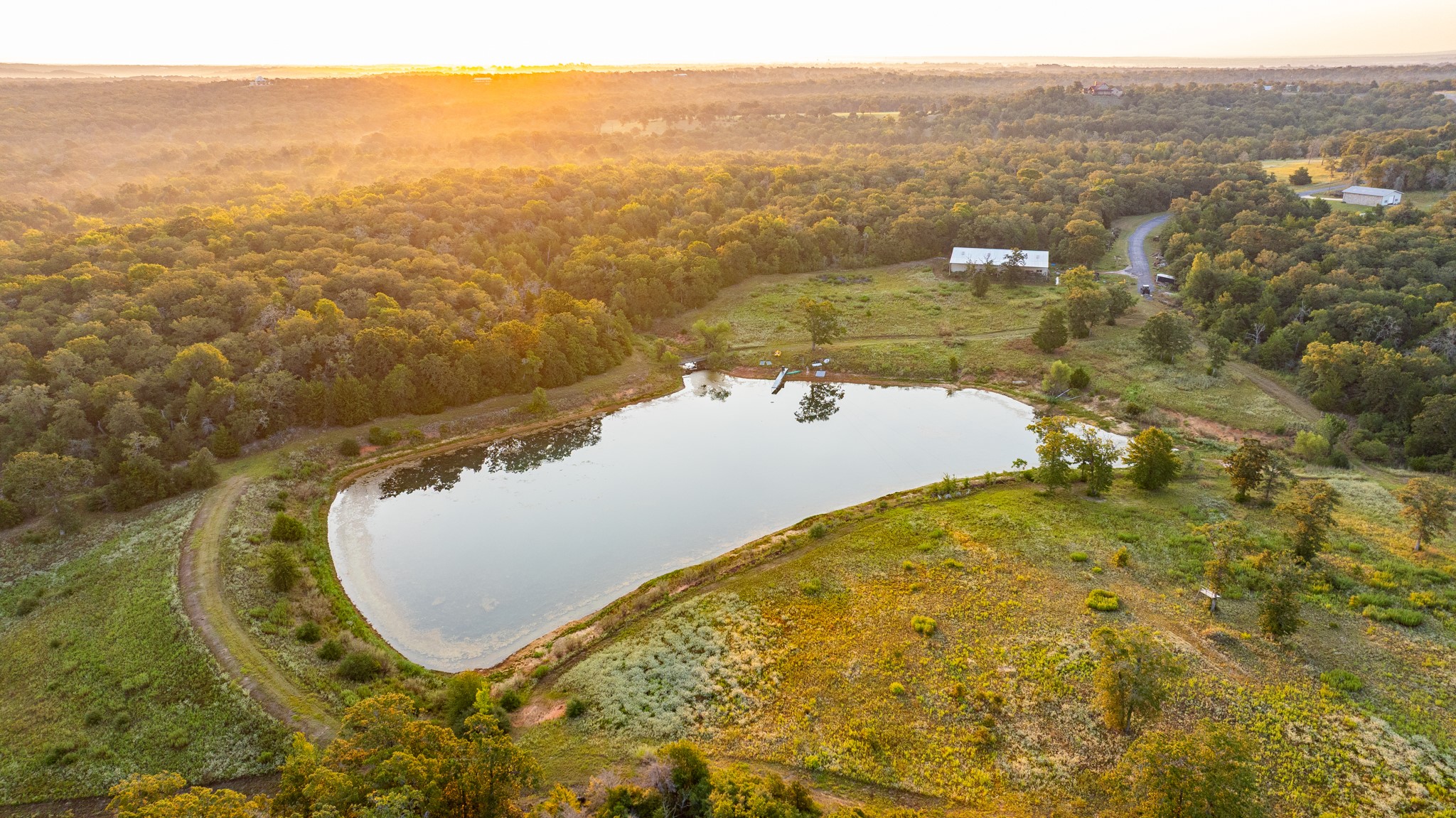 2042 22 Hills Road Gause, TX 77857 - Photo 4 of 50 an aerial view of residential houses with outdoor space