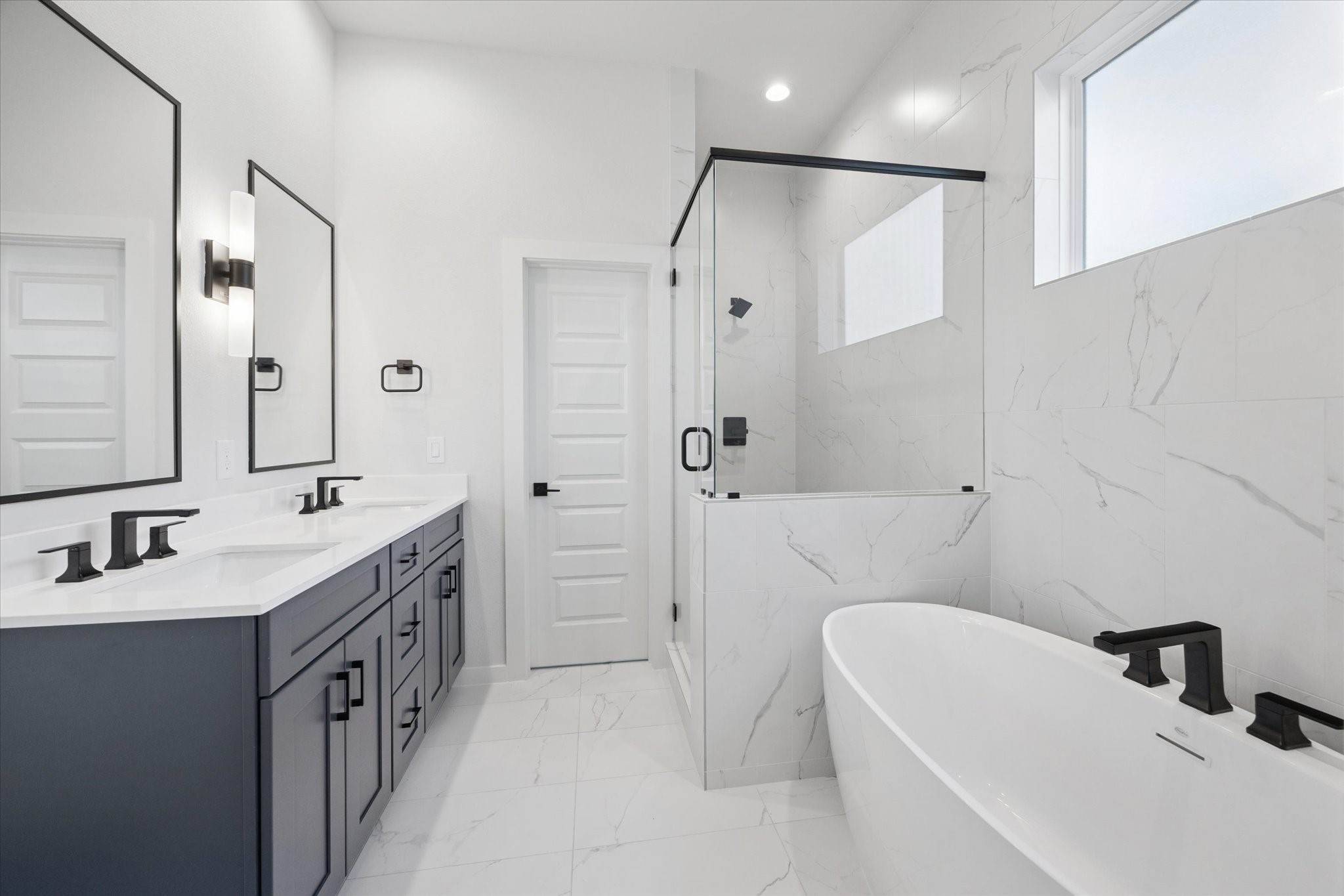 817 Thornton Road, Unit G Houston, TX 77018 - Photo 11 of 49 a bathroom with a double vanity sink a toilet and shower