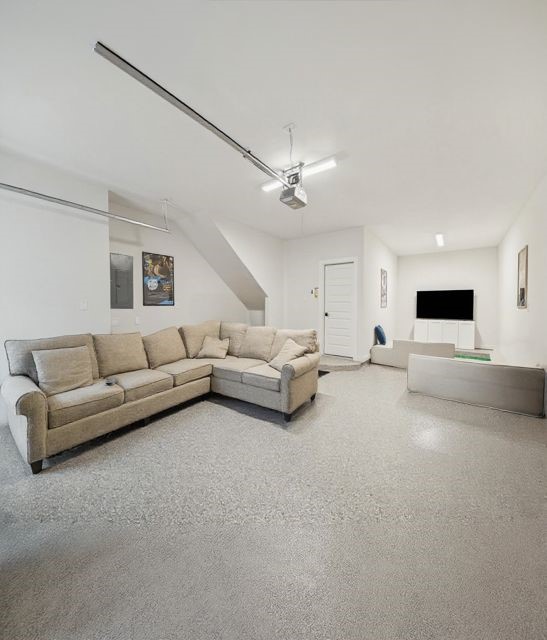 817 Thornton Road, Unit G Houston, TX 77018 - Photo 20 of 49 a living room with furniture and a chandelier
