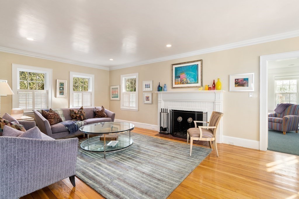 34 Risley Road Newton, MA 02465 - Photo 3 of 27 a living room with furniture and a fireplace