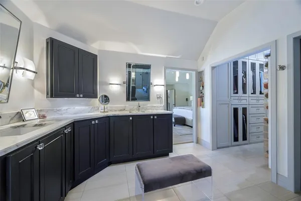 a kitchen with a sink and a refrigerator