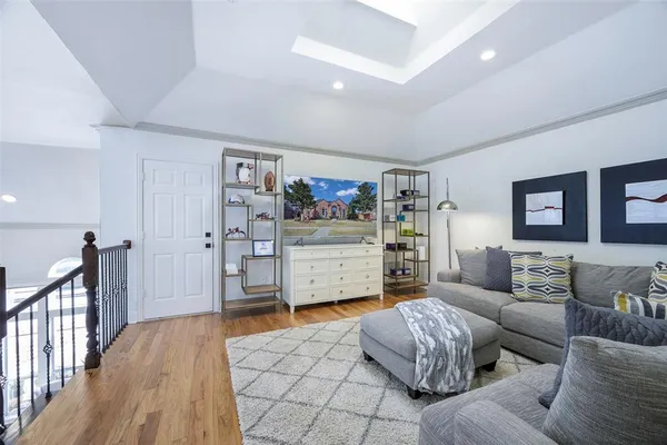 a spacious bedroom with a bed and a couch