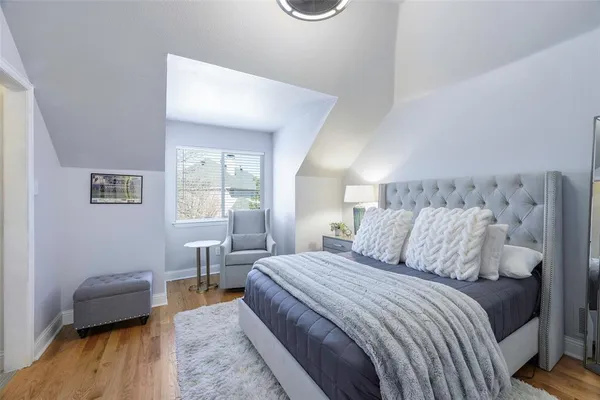 a bedroom with a bed and a couch