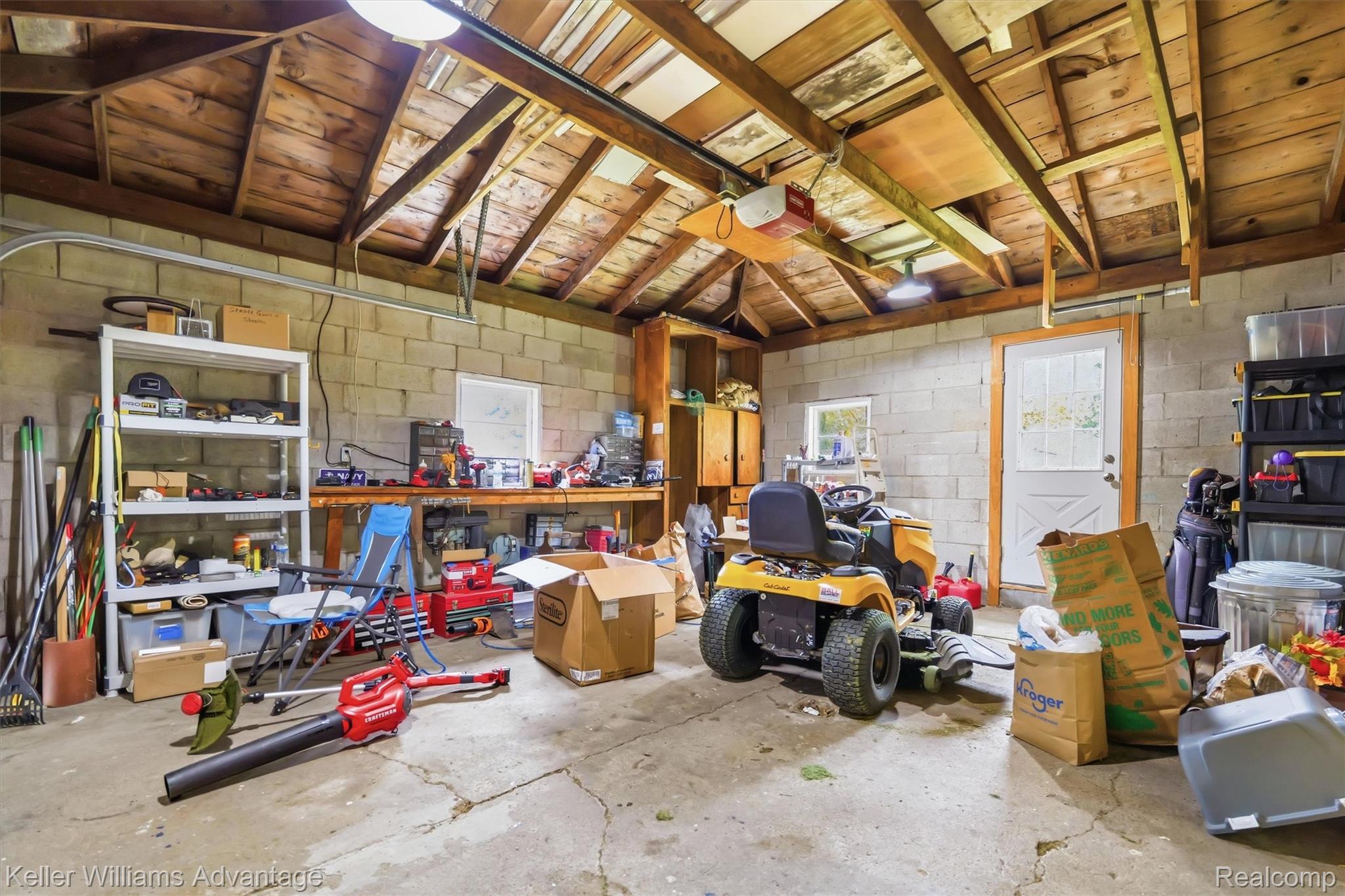 6595 Bray Road Vassar, MI 48768 - Photo 38 of 64 Storage room featuring a garage